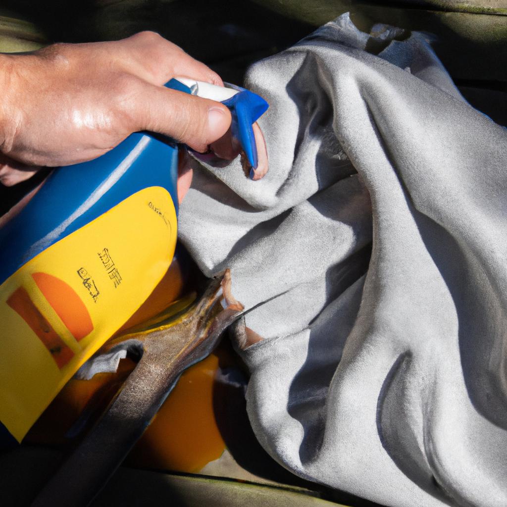 Properly wiping off excess WD-40 for a clean finish on garden tools.
